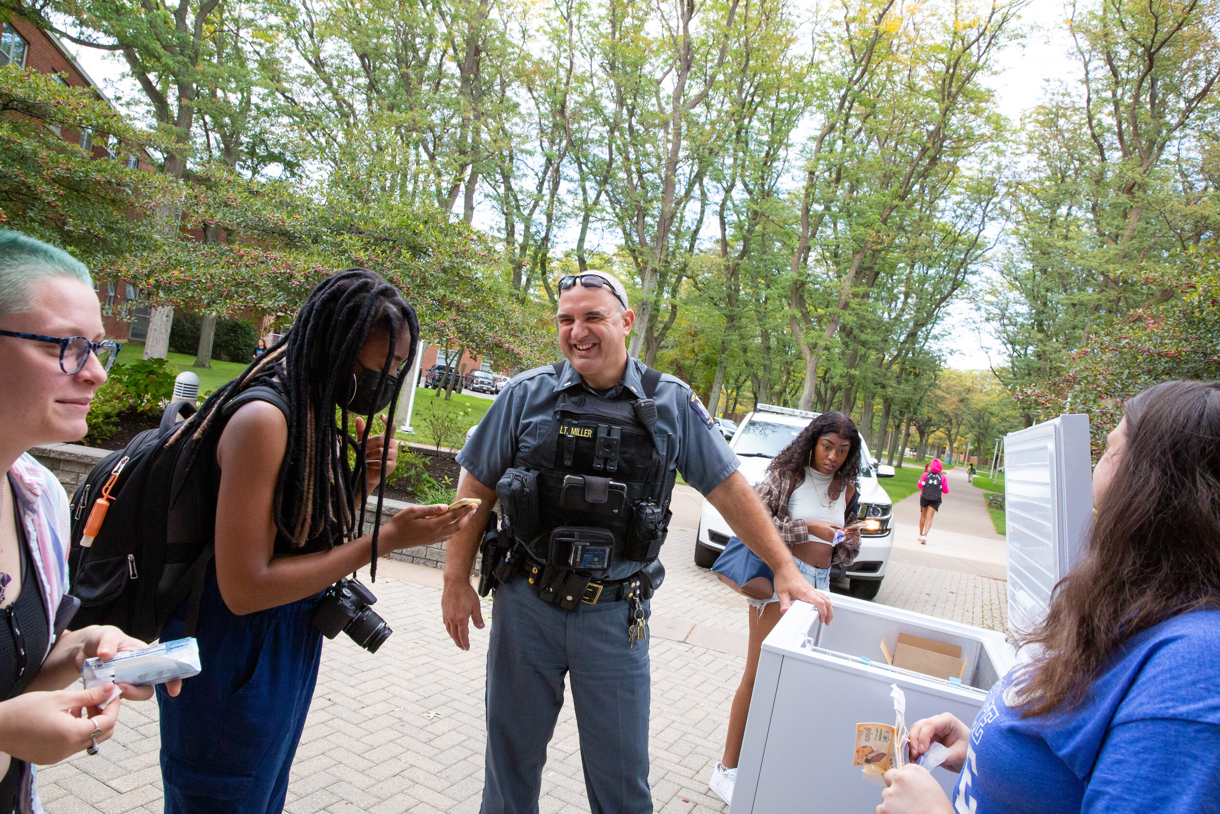 UPD officer speaking with students