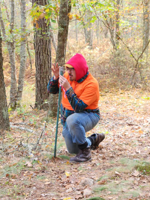 Gavin Kaminski determines the landscape slope (in degrees) using a clinometer.