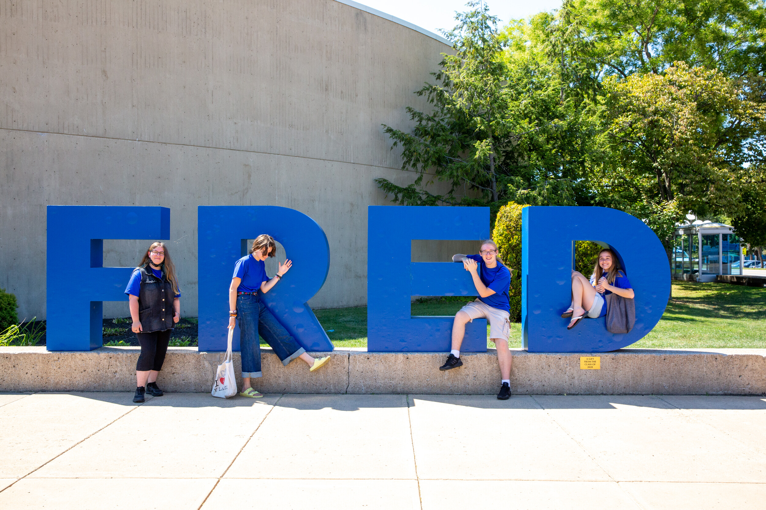 Fredonia students posing with the FRED sign