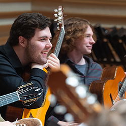 Guitar students in a rehearsal