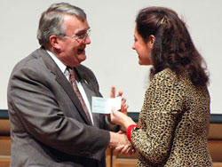 Judy Cope presents check to David Tiffany of the Fredonia College Foundation