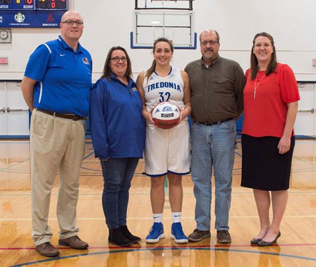 Jenna Einink with parents and coaches