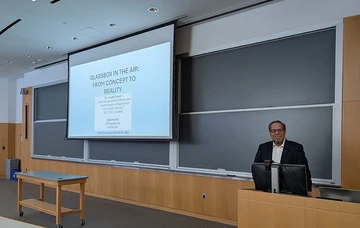 faculty member at lectern