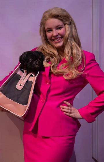 Elle Woods (Alina Wiley) holds dog used in production