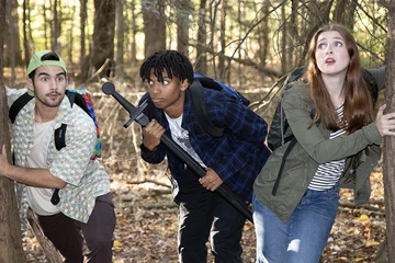 students searching in the woods