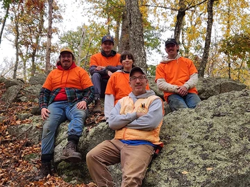 Gathering on a hillside are (from left): Gavin Kaminski, J. Weston Hepler, Rachel Echevarria, Dr. Matthew Purtill and Alex Gombos.