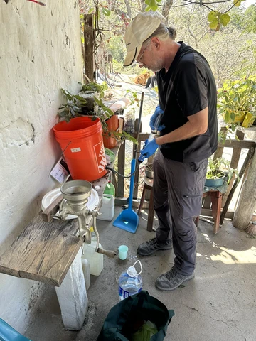 Dr. Ted Lee cleans a water filter during his Fulbright Fellowship in Honduras.