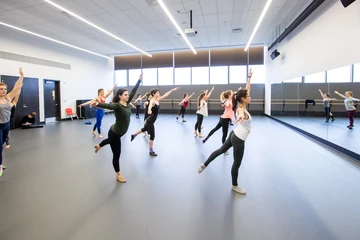 Dance students practicing their craft in the studio