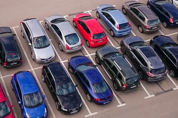 cars parked in a lot, seen from above