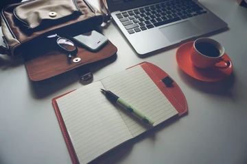 laptop, notebook, and coffee cup 