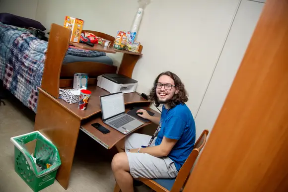 Fredonia student moving into his new dorm room