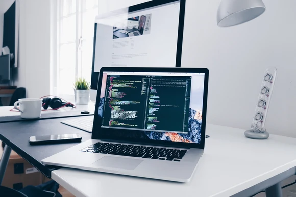 Computer on a desk with data visible