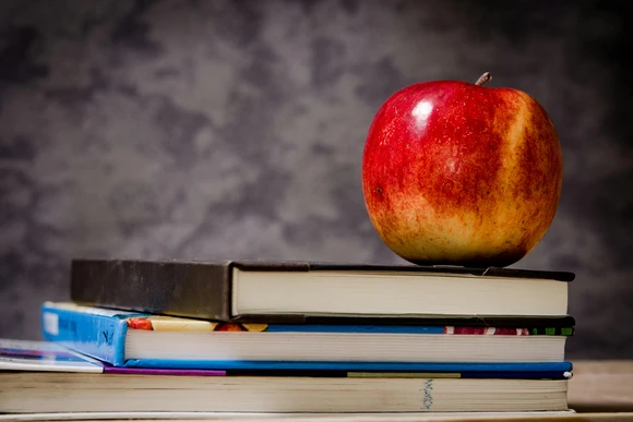 Apple and books. Fredonia students enjoy higher than average salaries in high school teaching in New York  