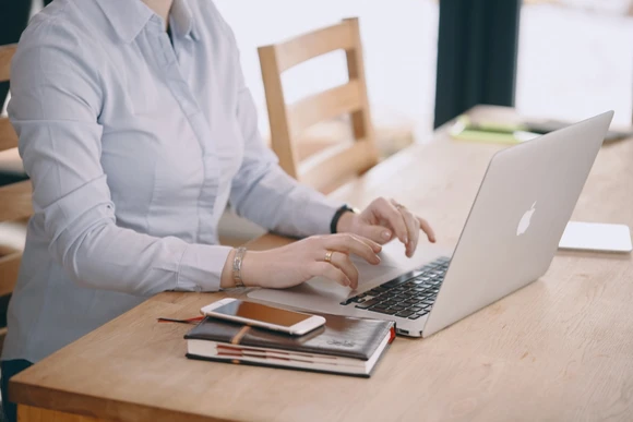 person seated at laptop