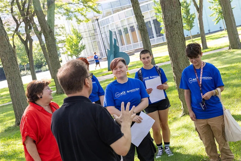 students outside working on an orientation challenge