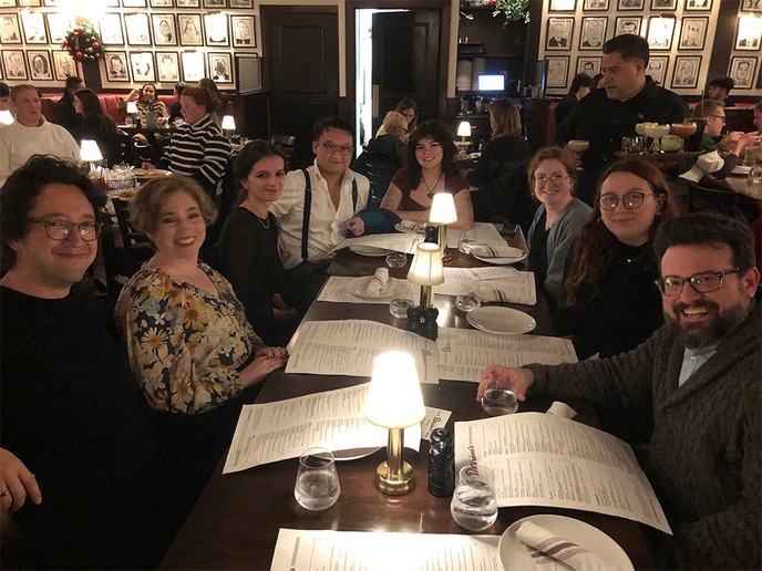 alumni sitting around a table in a restaurant