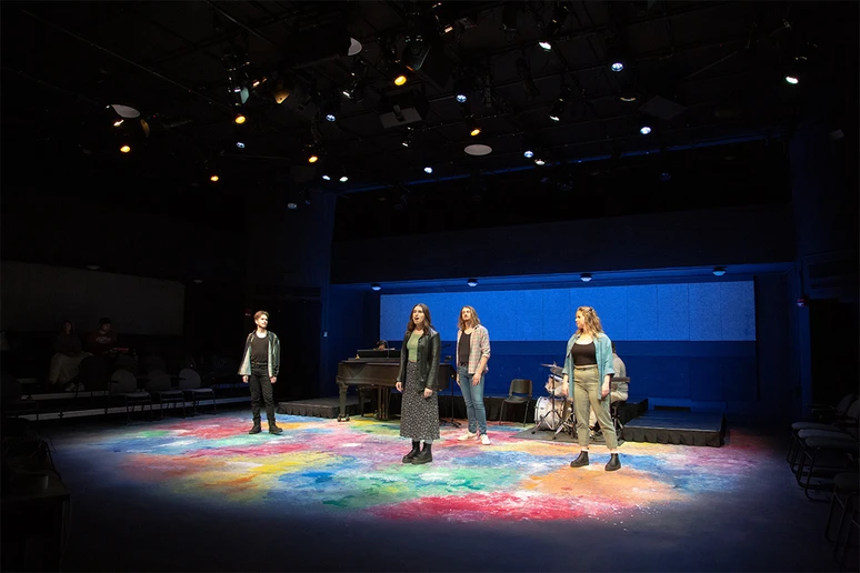 students on stage in Bartlett Theatre