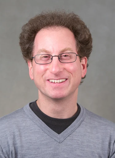 headshot of Dr. Bruce Simon