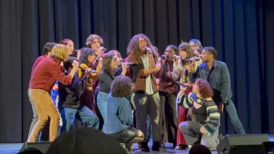 Christian Taber, encircled by fellow Dynamic Intonation members, as the soloist for “Me and Your Mama.” (Photo by Lou Shafer)