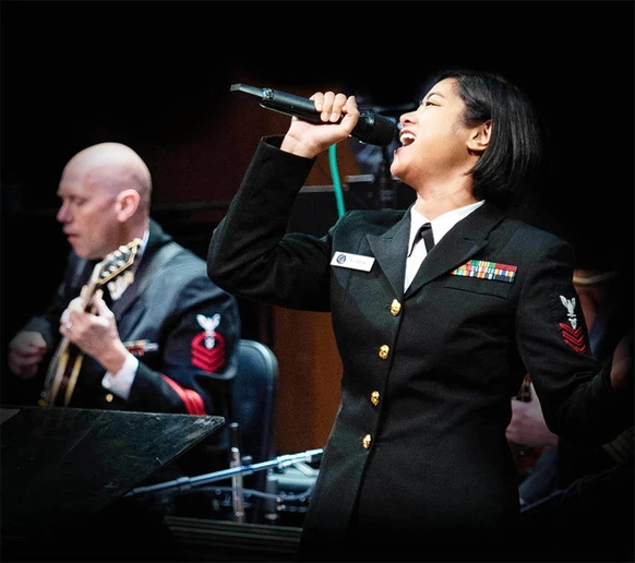 Kristine Hsia performs on stage with Commodores