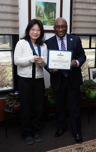 Amy Li with President Stephen H. Kolison Jr.