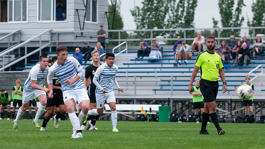 soccer teams playing on the field