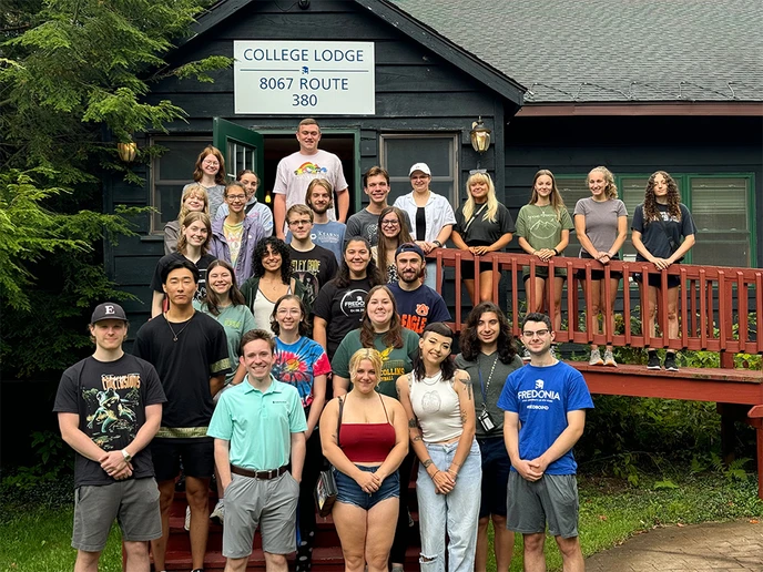 Learning Center tutors standing in front of the College Lodge.