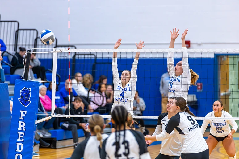 volleyball players in action in Dods Hall