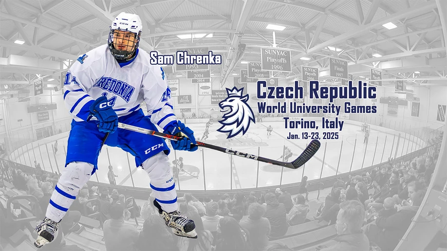 hockey player posing with ice rink in the background