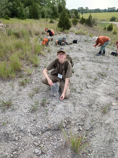 Jasper Bateman, looking for fossils in the Devonian Silica Shale during a mid-conference field trip, near Milan, MI. Inset photo of student at poster presentation