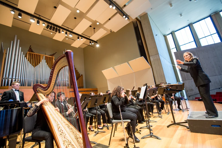 Fredonia wind ensemble students performing in the Rockefeller