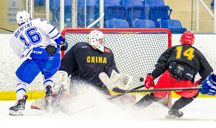 hockey players in action on the ice