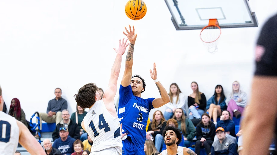 basketball players in action in Dods Hall