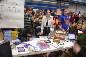 students at a sign up table at Activities Night