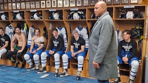 Charles Barkley in hockey locker room with players