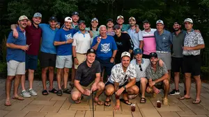 hockey players and coach at the golf tournament