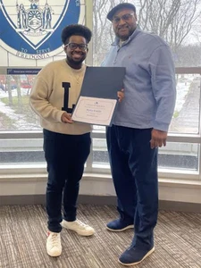 Niles Emile holding certificate, with David White