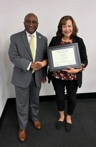 Lisa Schrantz and Fredonia President Dr. Stephen H. Kolison Jr.