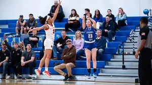 two basketball players in action on the court