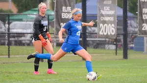 two women soccer players in action