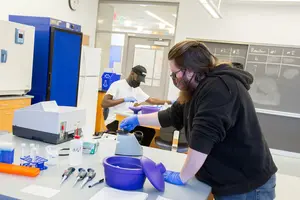 student working in a biology lab