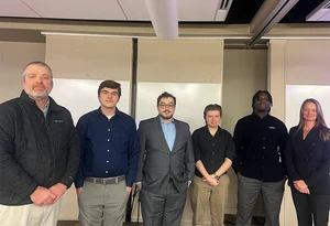 Chuck Cornell (left), director of the Center for Innovation and Economic Development, with students Zachary Dean (Shorewood Commerce); Miles Calloway (Fredonia Makerspace); Noah Meyer (Sonoro Records); and Lassana Sillah (Concrete Made), along with Lauri Gawronski, CIED project coordinator.