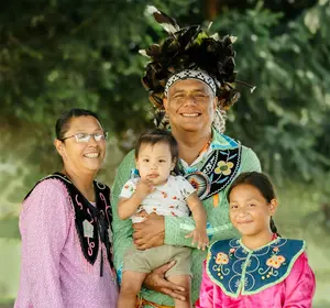 Lead Dancer for the Allegany River Seneca Dancers, Bill Crouse, and his family (photo by Brandon Rivera)