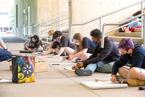 students drawing in a outdoor class