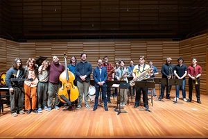 Dr. Nick Weiser (center) and 15 students who comprise the Fredonia Jazz Flextet, which won a top DownBeat Magazine’s Student Music Award gather for a group photo following the award announcement made in the Juliet J. Rosch Recital Hall.