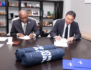 President Stephen J. Kolison Jr. and Yachiyo Shoin High School Principal Madoka Sakurai formalize a letter of intent to bring Japanese high school students to campus for a two-week summer learning experience.