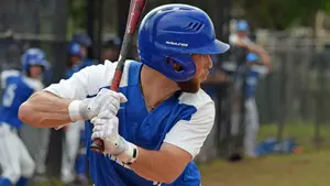 Johnny Genau playing baseball