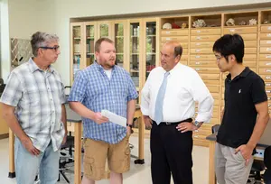 Four co-investigators in lab