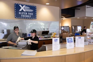 Jamie Crabtree, assistant service worker, and Elizabeth Morgunova, a senior majoring in Psychology, with minors in Creative Writing and Communication Disorders and Sciences, from Brooklyn, NY, get ready for the dinner rush.