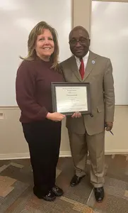 Rhonda Gominiak, receiving the Saletta award from President Stephen H. Kolison Jr.